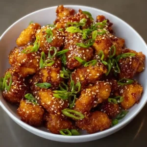 Zippys Korean Chicken Bites with Green Onion Garnish