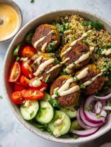 Mediterranean Falafel Bowl with Tomato-Cucumber Salad & Lemon-Herb Quinoa